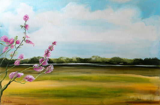 Field with a pink tree